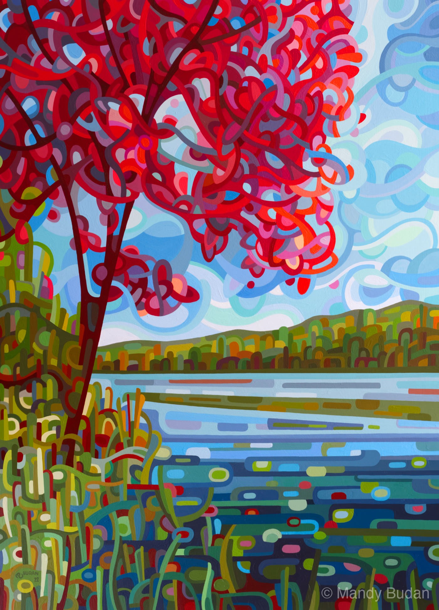 A single tree stands by the river while clouds scamper by; she knows her reds will soon fall. by Mandy Budan